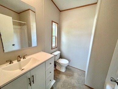 This 3-bedroom, 2-bathroom home is located on the outskirts of - photo 5