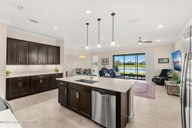 Enjoy waterfront living from this airy 3-bedroom, 4-bath home in - photo 2