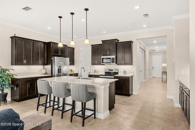 Enjoy waterfront living from this airy 3-bedroom, 4-bath home in - photo 3