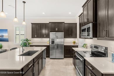 Enjoy waterfront living from this airy 3-bedroom, 4-bath home in - photo 4
