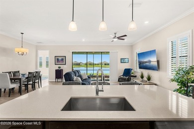 Enjoy waterfront living from this airy 3-bedroom, 4-bath home in - photo 6