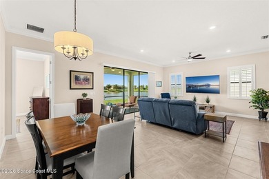 Enjoy waterfront living from this airy 3-bedroom, 4-bath home in - photo 9