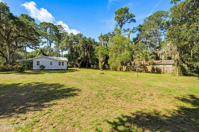 RARE FIND - Hidden beneath a canopy of majestic live oaks draped - photo 38