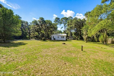 RARE FIND - Hidden beneath a canopy of majestic live oaks draped - photo 39