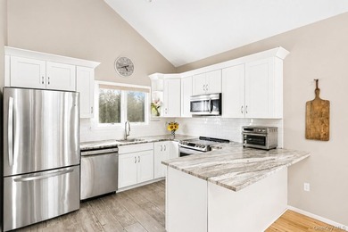 Located south of the highway on a private flag-lot, this updated - photo 4