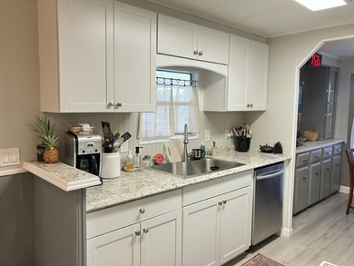 Charming 2BR 2BA home in a vibrant 55+ community. Features an - photo 2