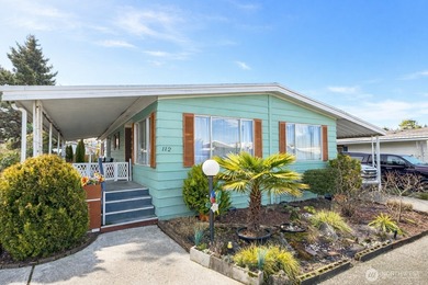 Welcome to this bright and airy manufactured home located in a