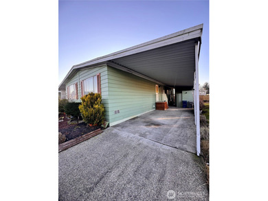Welcome to this bright and airy manufactured home located in a