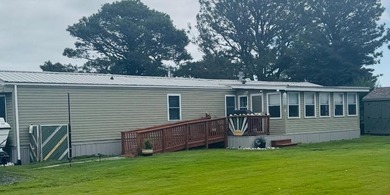 This totally renovated mobile home will be a pleasant surprise - photo 1