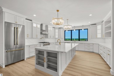 Commanding panoramic views of East Grand Traverse Bay from - photo 17