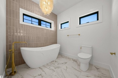 Commanding panoramic views of East Grand Traverse Bay from - photo 28
