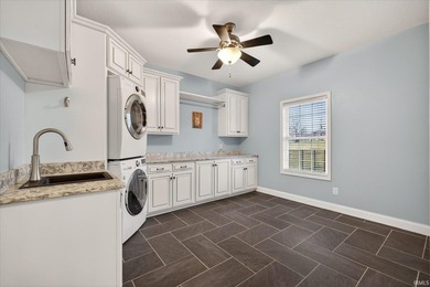 Situated on a quiet cul-de-sac, this exceptional home is set on - photo 13
