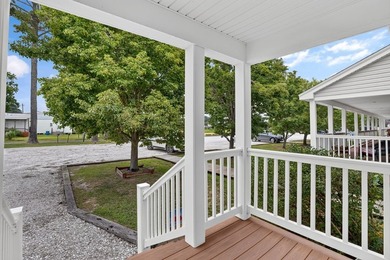 Enjoy easy coastal living in this beautifully maintained - photo 4
