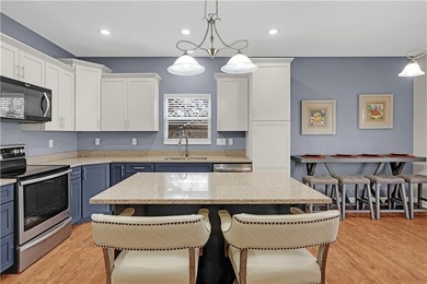 This expansive home in Warsaw, MO offers a blend of comfort and - photo 14