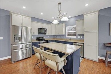 This expansive home in Warsaw, MO offers a blend of comfort and - photo 15