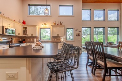 Secluded on Fontana Lake, this modern-mountain, custom-built - photo 23