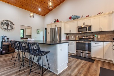 Secluded on Fontana Lake, this modern-mountain, custom-built - photo 24