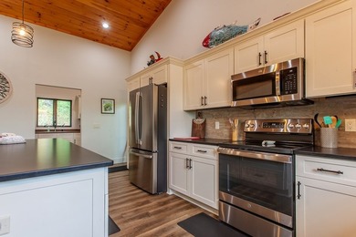 Secluded on Fontana Lake, this modern-mountain, custom-built - photo 26