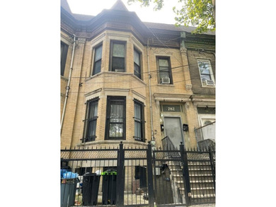 Large brick fully renovated multi family in the Longwood section - photo 1