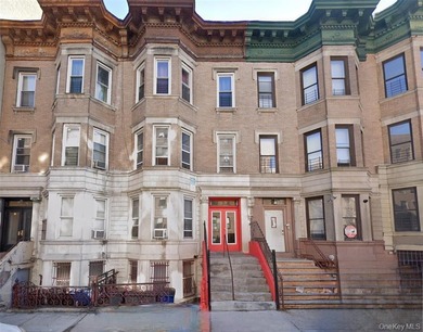 This legal 3-family zoned R7-1 with a building size of 20x55 - photo 1