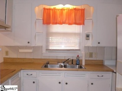 Desirable location just off Wade Hampton Boulevard suitable for