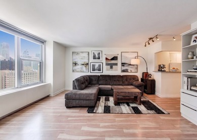 Located on a high floor right on the Magnificent Mile, this - photo 3