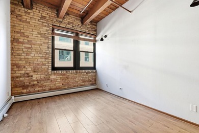 Located on a quiet street in the heart of the North Loop, you - photo 9