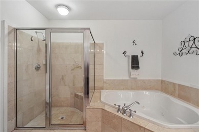 Truly a rare find, this stepless first-floor 2 bed, 2 bath condo