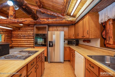 Experience the warmth and character of log home living in this - photo 11