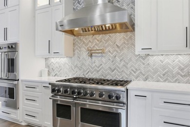 Luxury lakefront living awaits in this custom-built 2022 home on - photo 11