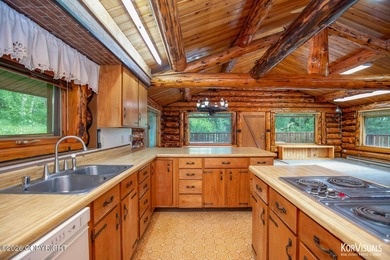 Experience the warmth and character of log home living in this - photo 12