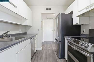 Stylishly updated end-unit condo with a large private deck &