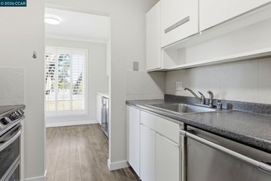 Stylishly updated end-unit condo with a large private deck &