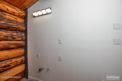 Experience the warmth and character of log home living in this - photo 16