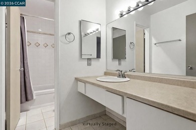 Stylishly updated end-unit condo with a large private deck &