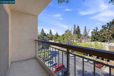 Stylishly updated end-unit condo with a large private deck &