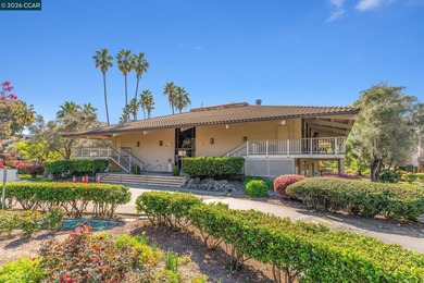 Stylishly updated end-unit condo with a large private deck &