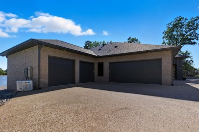 Luxury lakefront living awaits in this custom-built 2022 home on - photo 41