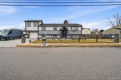 Welcome to 568 Centerwood Street in West Babylon, a hi-ranch - photo 1