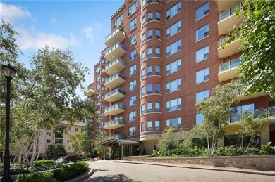 Modern Plaza-side condo with wraparound balcony and custom