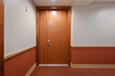 Modern Plaza-side condo with wraparound balcony and custom