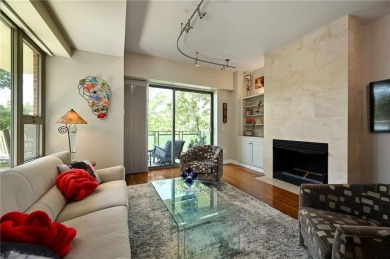 Modern Plaza-side condo with wraparound balcony and custom