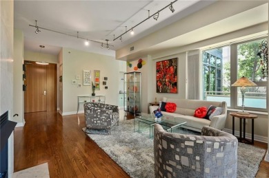 Modern Plaza-side condo with wraparound balcony and custom