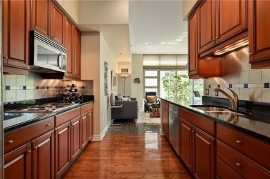 Modern Plaza-side condo with wraparound balcony and custom