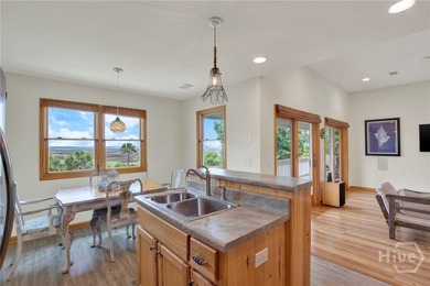 This custom-built coastal cottage sits on a scenic bluff - photo 12