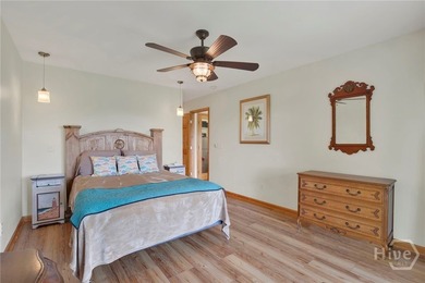 This custom-built coastal cottage sits on a scenic bluff - photo 17