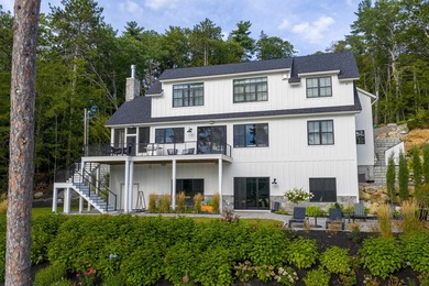 Set on nearly an acre with 201 feet of pristine Lake - photo 3