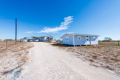 ENJOY THE QUIET OF THE COUNTRY ON THIS BEAUTIFUL 10-ACRE TRACT