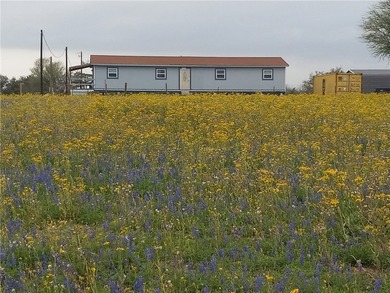 ENJOY THE QUIET OF THE COUNTRY ON THIS BEAUTIFUL 10-ACRE TRACT