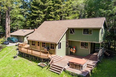 Perched among the trees on 3.24 private acres, this inviting - photo 1